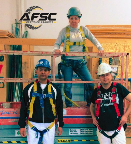 AFSC instructor demonstrating fall arrest harness fit