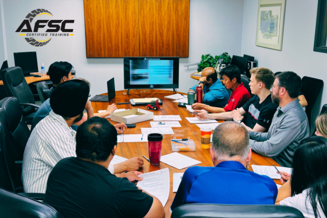 In-house trainer evaluating an equipment operator
